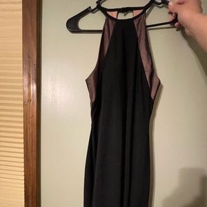 Black halter dress with open back. Worn twice. In great condition. Tea length